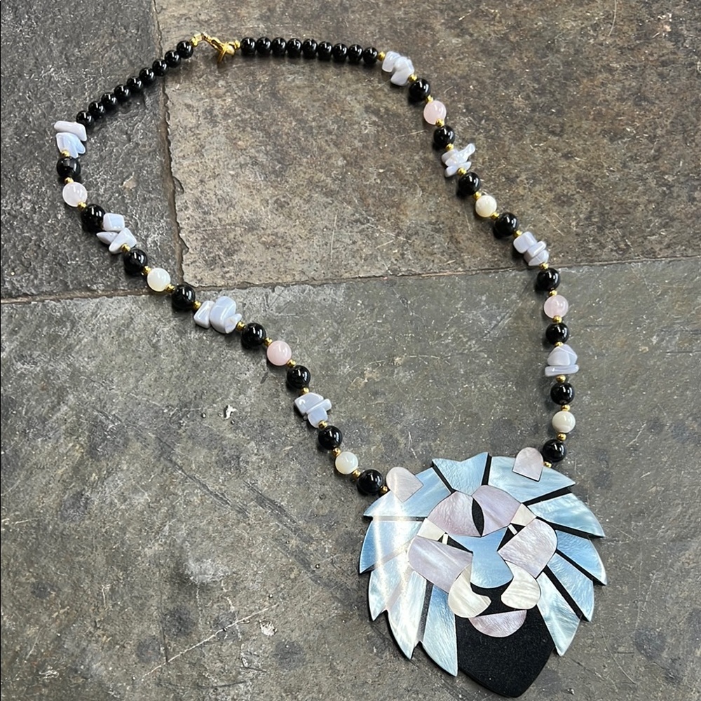 Lee Sands Mother of Pearl lion necklace.
